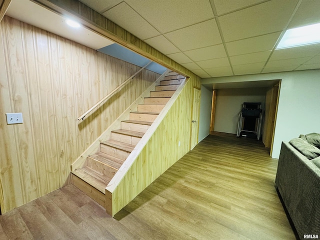 3621 Andrews Ct, Salem, IL 62881 - finished basement with wood finished floors, wooden walls, and stairway