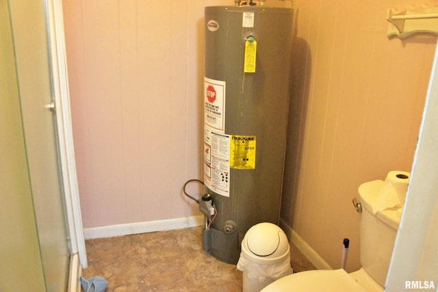 207 Butler St, Metropolis, IL 62960 - bathroom with water heater, toilet, and baseboards
