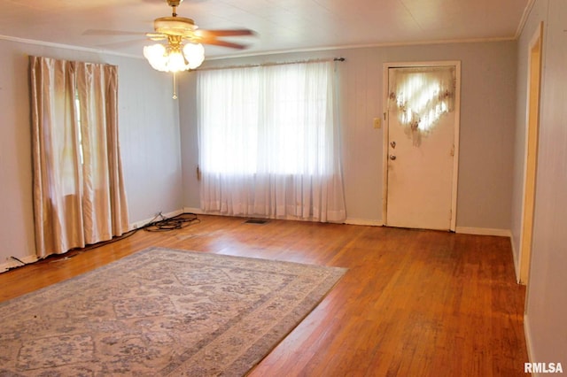 207 Butler St, Metropolis, IL 62960 - entrance foyer featuring ornamental molding, wood finished floors, ceiling fan, and baseboards