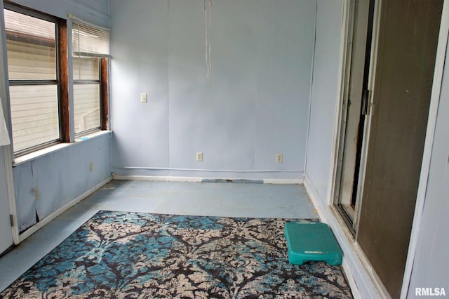 207 Butler St, Metropolis, IL 62960 - spare room featuring concrete flooring and baseboards