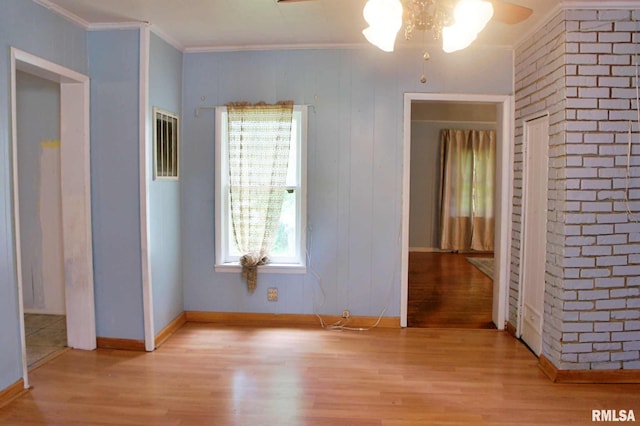 207 Butler St, Metropolis, IL 62960 - spare room with wood finished floors, a ceiling fan, crown molding, and baseboards