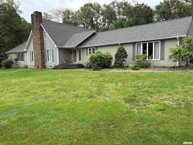 13916 Leisure Ln, Benton, IL 62812 - ranch-style home featuring a chimney, a front yard, and roof with shingles