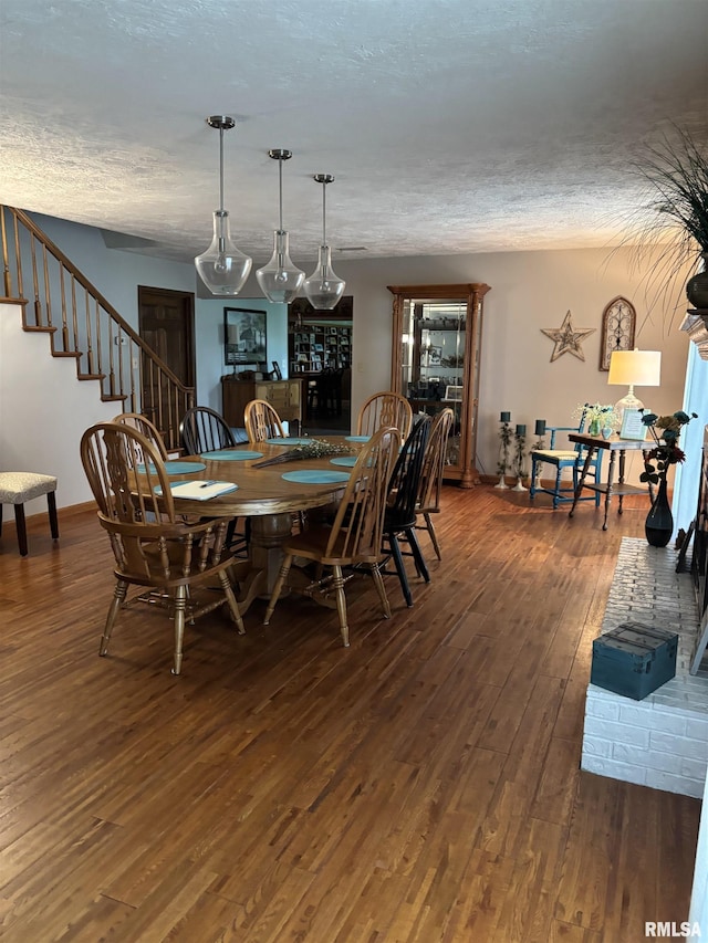 13916 Leisure Ln, Benton, IL 62812 - dining room featuring hardwood / wood-style floors, a textured ceiling, stairway, and baseboards