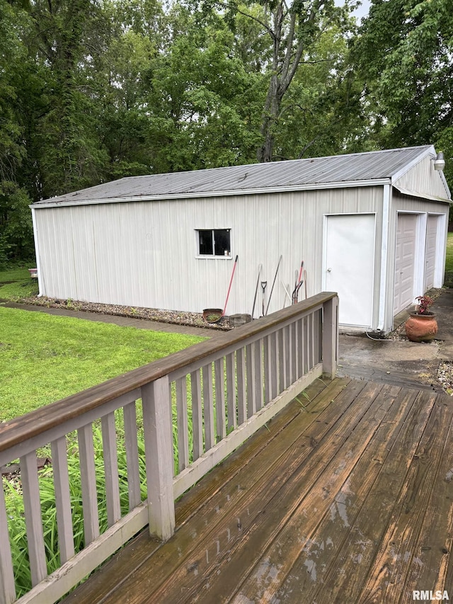 13916 Leisure Ln, Benton, IL 62812 - wooden deck with a detached garage, an outdoor structure, view of scattered trees, and a yard