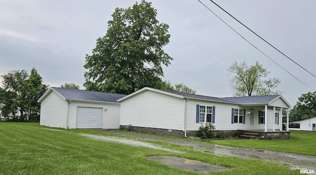 403 E Sycamore St, Kinmundy, IL 62854 - view of home's exterior featuring a yard and an attached garage