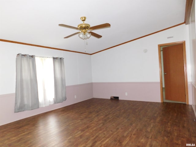 403 E Sycamore St, Kinmundy, IL 62854 - unfurnished room featuring a ceiling fan, wood finished floors, vaulted ceiling, a wainscoted wall, and crown molding