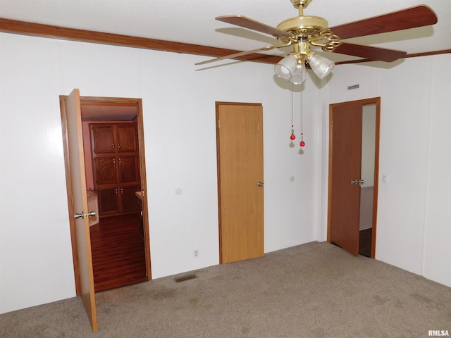 403 E Sycamore St, Kinmundy, IL 62854 - unfurnished bedroom featuring carpet floors and ceiling fan