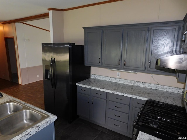 403 E Sycamore St, Kinmundy, IL 62854 - kitchen featuring black fridge with ice dispenser, a sink, gray cabinets, and light countertops