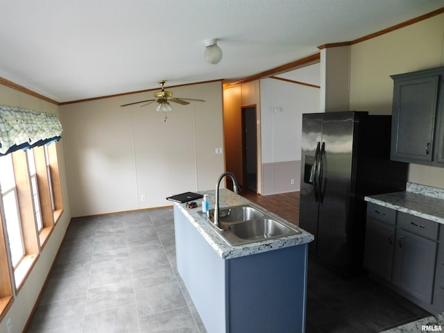 403 E Sycamore St, Kinmundy, IL 62854 - kitchen featuring a sink, ceiling fan, crown molding, plenty of natural light, and stainless steel fridge