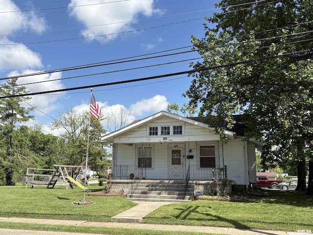 bungalow-style house featuring a front lawn and a porch