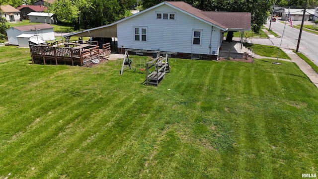 back of property featuring a yard