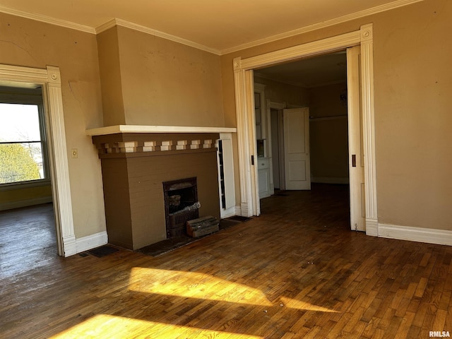 402 S Main St, Benton, IL 62812 - unfurnished living room featuring dark wood finished floors, a fireplace with flush hearth, baseboards, and ornamental molding