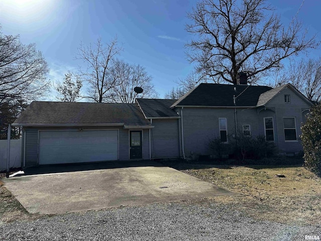 402 S Main St, Benton, IL 62812 - view of front of house featuring a garage, driveway, and a chimney