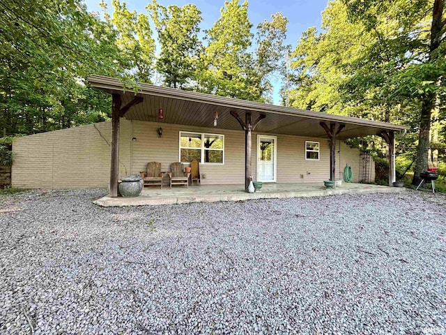 7544 Geranium Rd, Oakdale, IL 62268 - back of house featuring covered porch and driveway