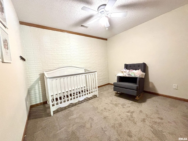 7544 Geranium Rd, Oakdale, IL 62268 - carpeted bedroom featuring a textured ceiling, a crib, baseboards, and ceiling fan