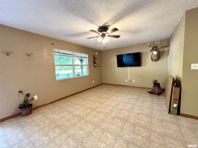 7544 Geranium Rd, Oakdale, IL 62268 - unfurnished room with a ceiling fan, a textured ceiling, and baseboards
