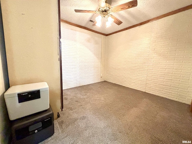 7544 Geranium Rd, Oakdale, IL 62268 - unfurnished room featuring carpet floors, a ceiling fan, brick wall, ornamental molding, and a textured ceiling