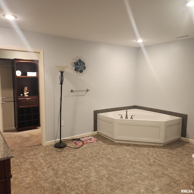 15267 N Woodlawn Ln, Woodlawn, IL 62898 - bathroom with a bath and baseboards