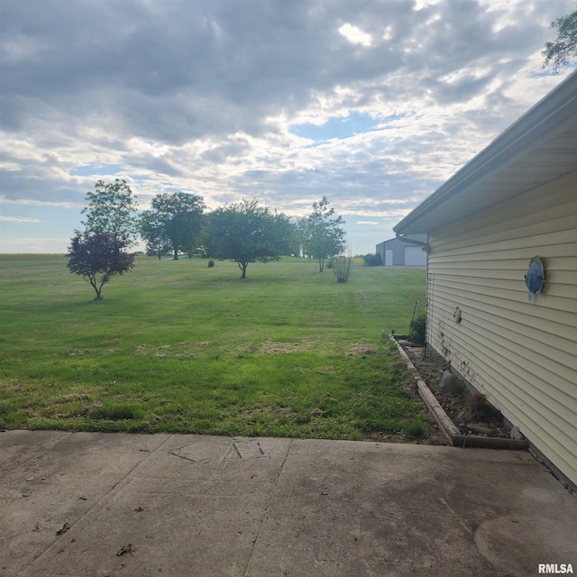 15267 N Woodlawn Ln, Woodlawn, IL 62898 - view of green lawn with a patio area and a rural view