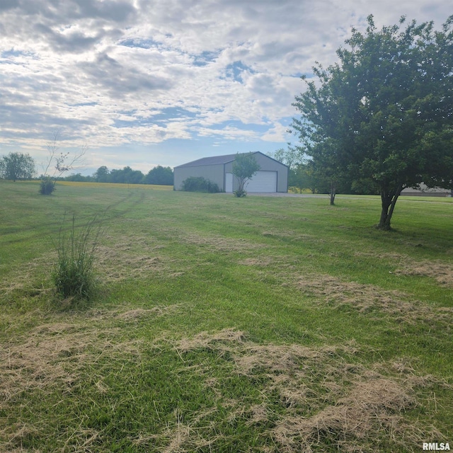 15267 N Woodlawn Ln, Woodlawn, IL 62898 - view of green lawn with an outbuilding, a detached garage, a pole building, and a view of countryside