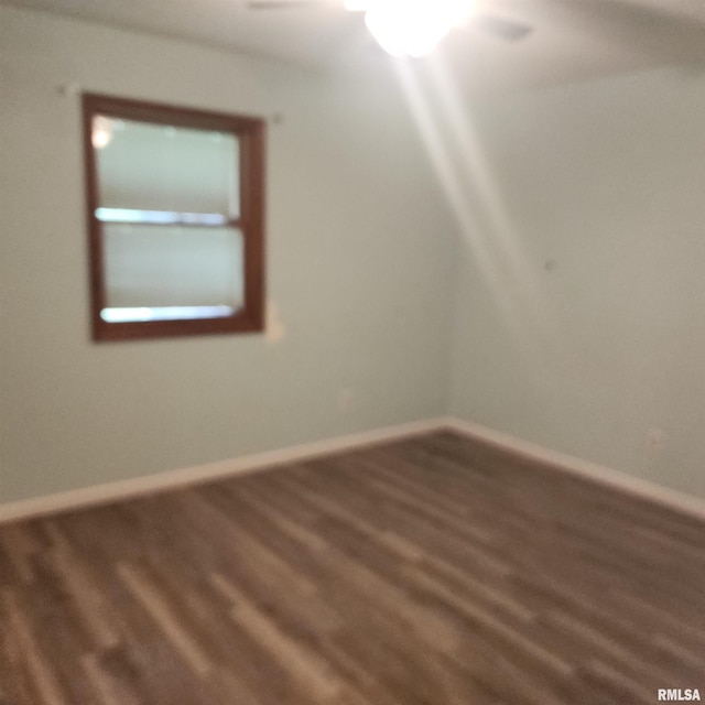 15267 N Woodlawn Ln, Woodlawn, IL 62898 - spare room featuring wood finished floors, baseboards, and a ceiling fan