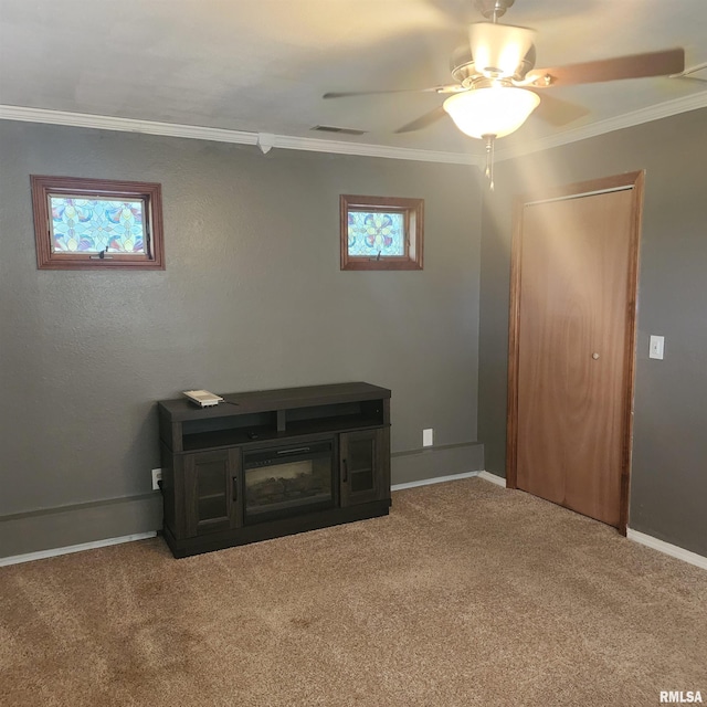 15267 N Woodlawn Ln, Woodlawn, IL 62898 - unfurnished living room featuring ornamental molding, carpet, ceiling fan, and baseboards
