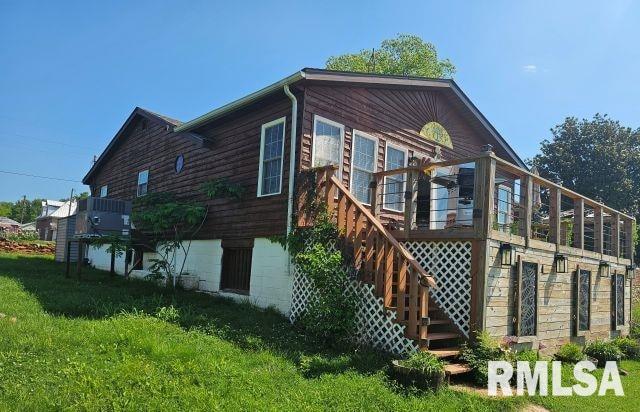 160 Front St, Elizabethtown, IL 62931 - rear view of house featuring a lawn, a wooden deck, and stairs