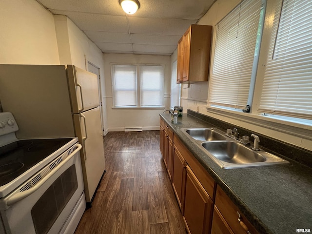 404 W Elm St, Carbondale, IL 62901 - kitchen featuring electric range, brown cabinets, dark countertops, a paneled ceiling, and a sink