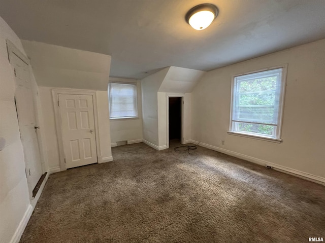 404 W Elm St, Carbondale, IL 62901 - bonus room with plenty of natural light, vaulted ceiling, carpet flooring, and baseboards