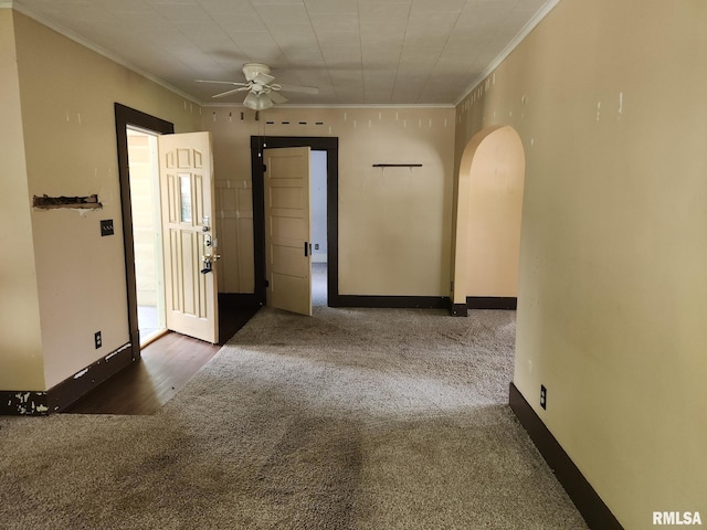 105 E Rea St, Valier, IL 62891 - carpeted spare room with arched walkways, crown molding, a ceiling fan, and baseboards