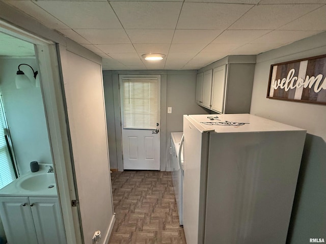6556 S US-45 Rd, Brookport, IL 62910 - washroom featuring washer and clothes dryer, cabinet space, plenty of natural light, and baseboards