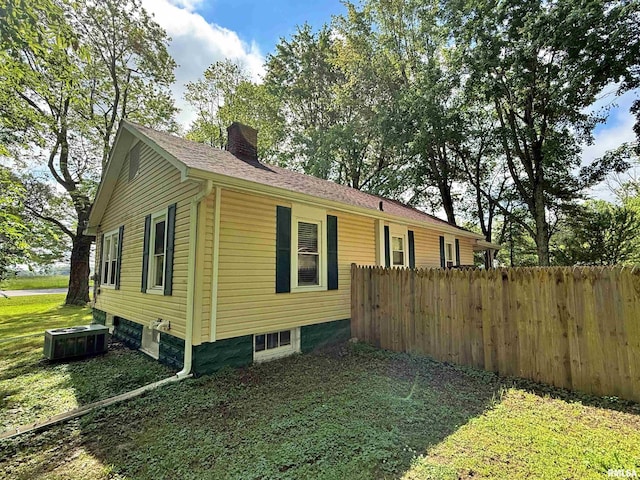 6556 S US-45 Rd, Brookport, IL 62910 - view of property exterior with a chimney and central AC