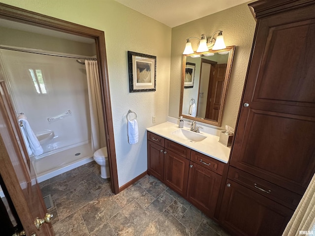 23208 N US Highway 51, Centralia, IL 62801 - bathroom with a textured wall, stone tile floors, baseboards, a shower with shower curtain, and vanity