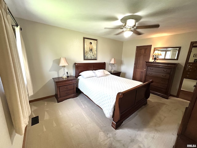 23208 N US Highway 51, Centralia, IL 62801 - bedroom featuring light carpet, baseboards, and a ceiling fan