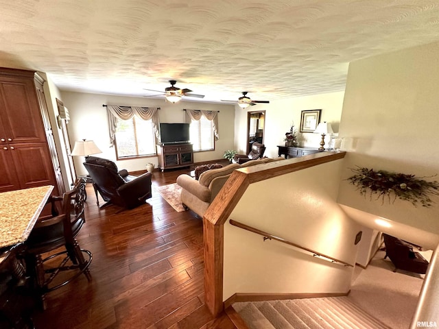23208 N US Highway 51, Centralia, IL 62801 - living area with dark wood-type flooring, ceiling fan, baseboards, and a textured ceiling