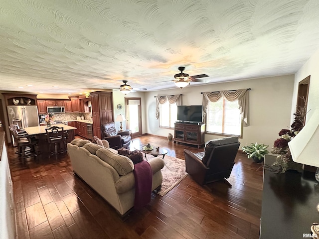 23208 N US Highway 51, Centralia, IL 62801 - living room with a ceiling fan and dark wood-type flooring