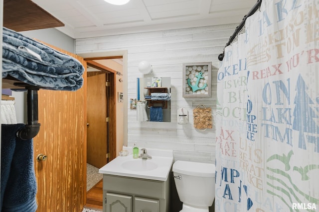 2560 Egyptian Hills Dr, Creal Springs, IL 62922 - bathroom featuring wooden walls, vanity, toilet, and a shower with shower curtain