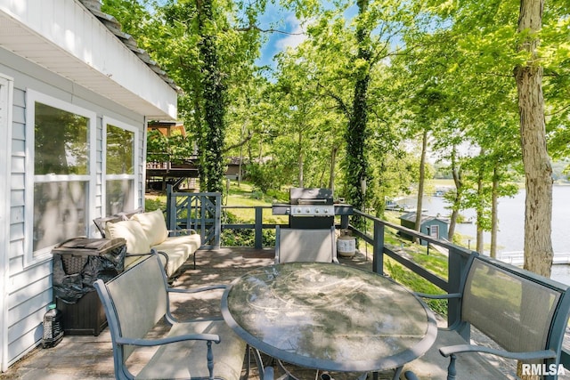 2560 Egyptian Hills Dr, Creal Springs, IL 62922 - deck featuring outdoor dining area, a grill, and view of scattered trees