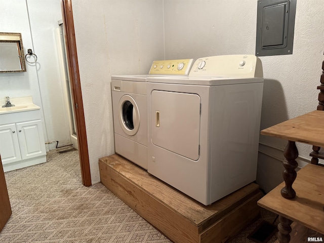 405 S Park Ct, Percy, IL 62292 - laundry room with washer and clothes dryer, electric panel, a sink, and light colored carpet