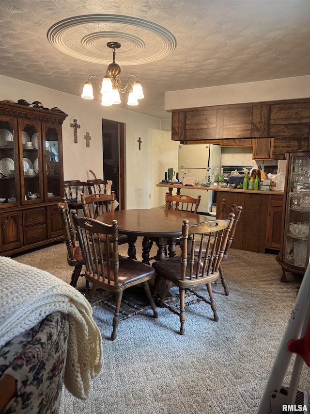 405 S Park Ct, Percy, IL 62292 - dining area featuring a chandelier, a textured ceiling, and light colored carpet