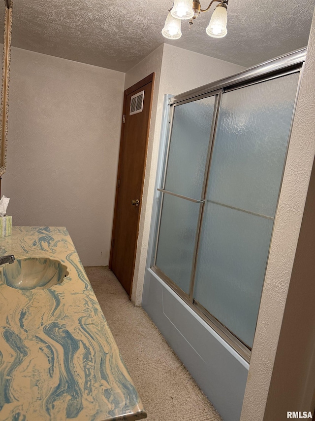 405 S Park Ct, Percy, IL 62292 - full bathroom featuring bath / shower combo with glass door, a sink, a textured ceiling, and a chandelier