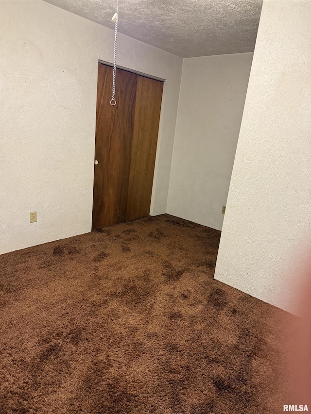 405 S Park Ct, Percy, IL 62292 - empty room with carpet flooring and a textured ceiling