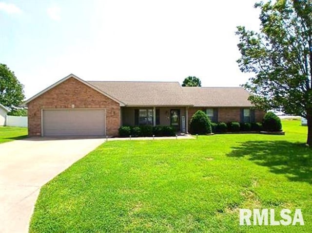 103 Chase Ln, Marion, IL 62959 - single story home with a front yard, concrete driveway, a garage, and brick siding