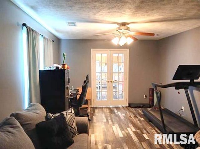 103 Chase Ln, Marion, IL 62959 - exercise room featuring french doors, ceiling fan, wood finished floors, a textured ceiling, and baseboards