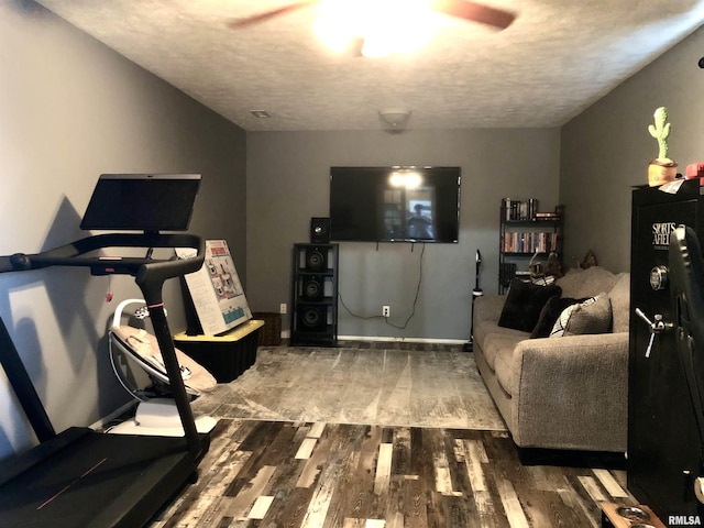 103 Chase Ln, Marion, IL 62959 - exercise area featuring wood finished floors, a textured ceiling, a ceiling fan, and baseboards