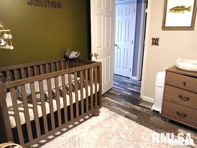 103 Chase Ln, Marion, IL 62959 - bedroom with dark wood-style floors and a chandelier