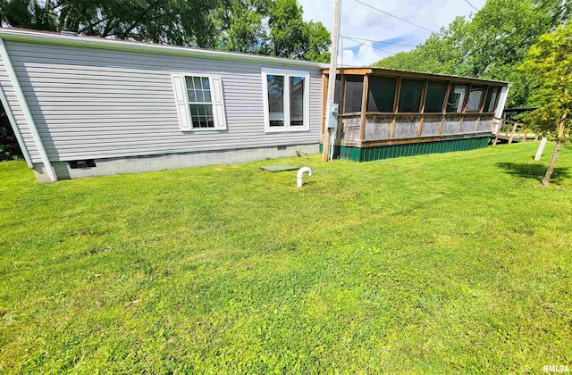 1011 Clan St, Flora, IL 62839 - back of property with crawl space, a yard, and a sunroom