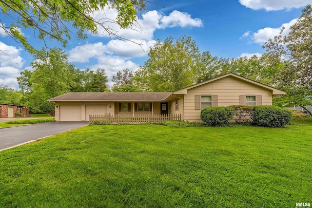 2605 W Sunset Dr, Carbondale, IL 62901 - ranch-style house with asphalt driveway, a garage, and a front yard