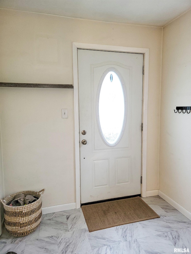 214 W 12th St, Flora, IL 62839 - foyer featuring light marble finish floors and baseboards