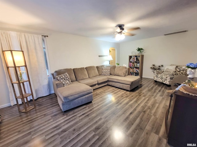 214 W 12th St, Flora, IL 62839 - living room featuring a ceiling fan, dark wood-type flooring, and baseboards